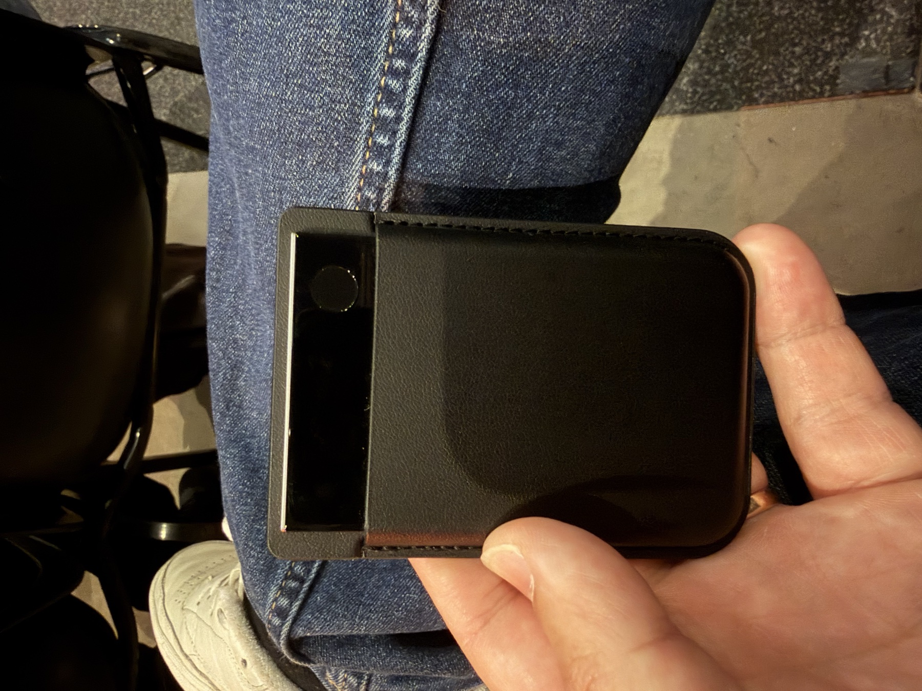 Plaud Note Pro in its black case being used from a seat at Fortuna One
